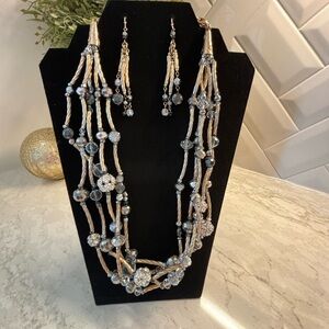 Chico’s gold, silver sparkling necklace and earrings.